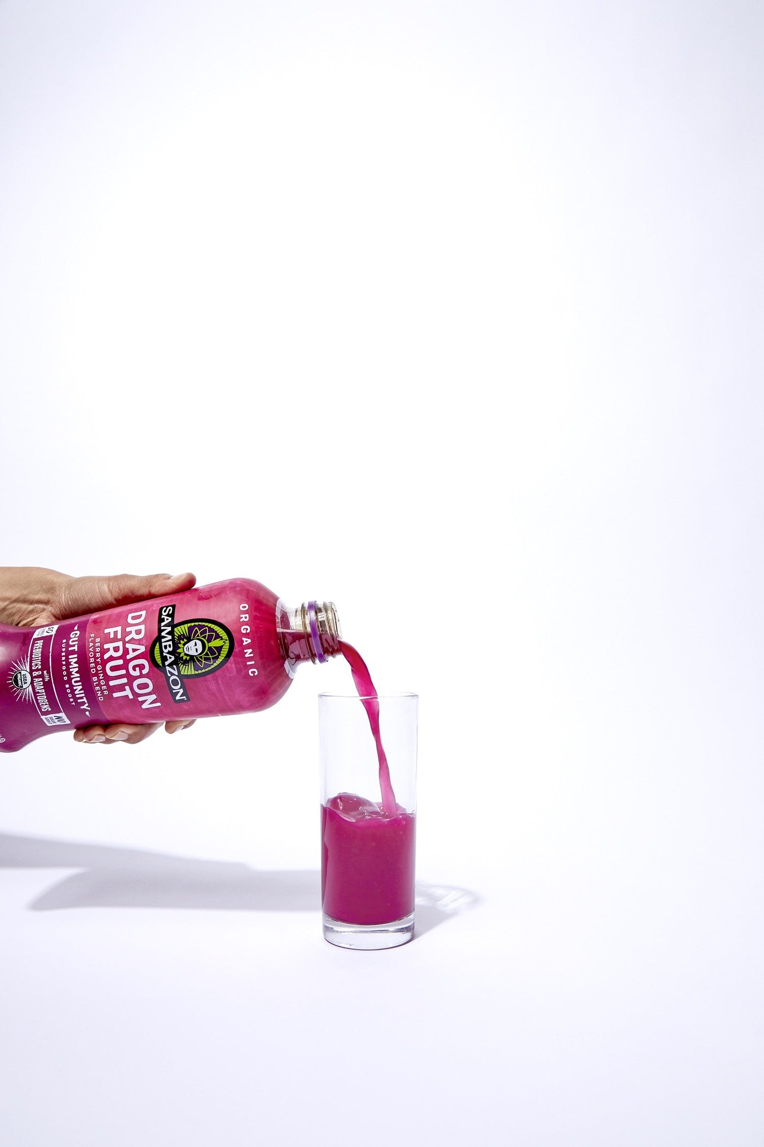 dragon fruit juice with bright pink color poured into glass