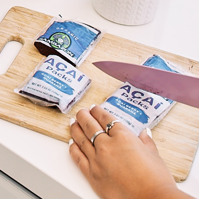 cut open frozen acai packets with a knife